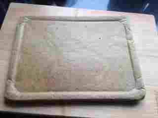 11、抹茶肉松蛋糕卷,取出倒扣撕下油纸