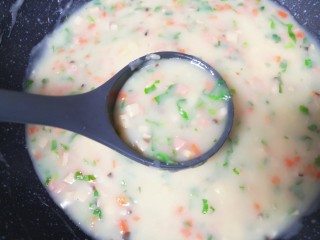 13、玉米面糊糊,再次烧开以后关火。