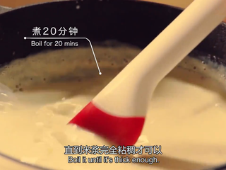 6、橙香米蛋糕,到时间后,再加入850ml的牛奶,中火煮20分钟,同样要不停搅拌,直到米浆完全粘稠即可