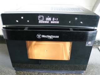 10、四喜蒸饺,接通电源，启动西屋蒸烤箱，选择菜单中的蒸汽功能，按确定键；